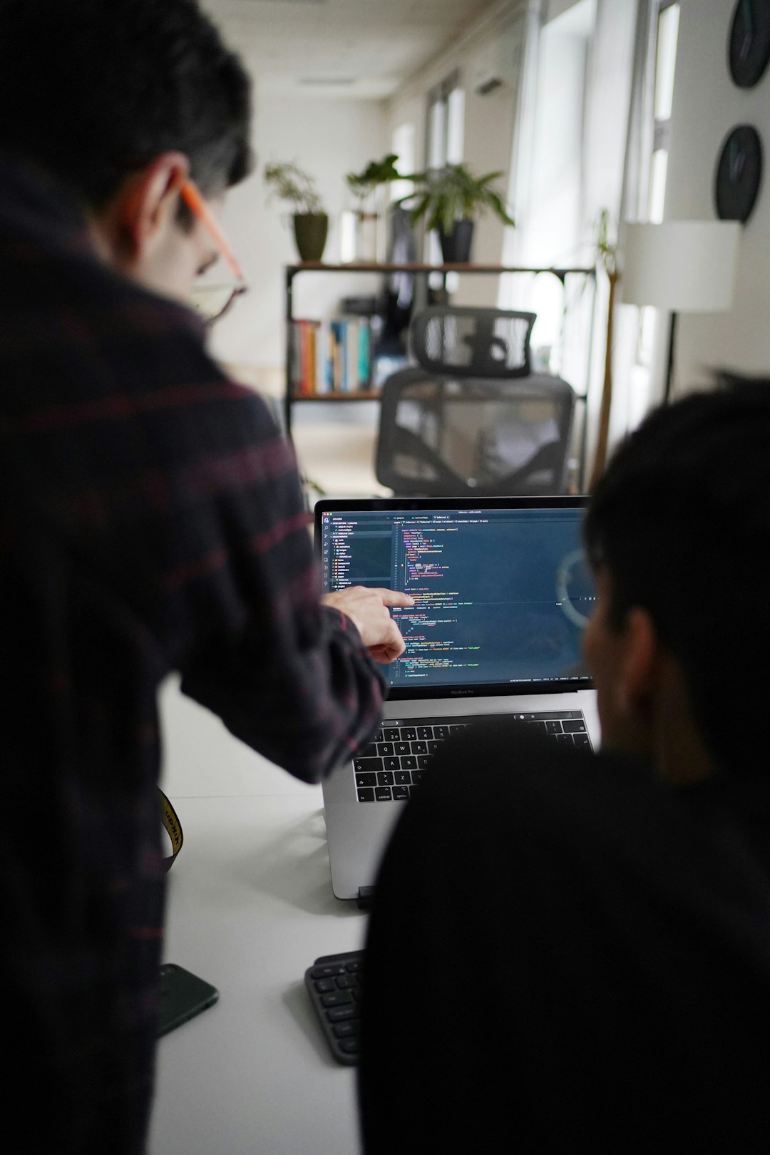 about-us-01 man-in-black-and-red-plaid-shirt-using-black-and-gray-laptop-computer-7obmqz4bfrq